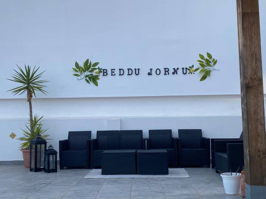 Shared terrace with sofas at b & b Jasmine